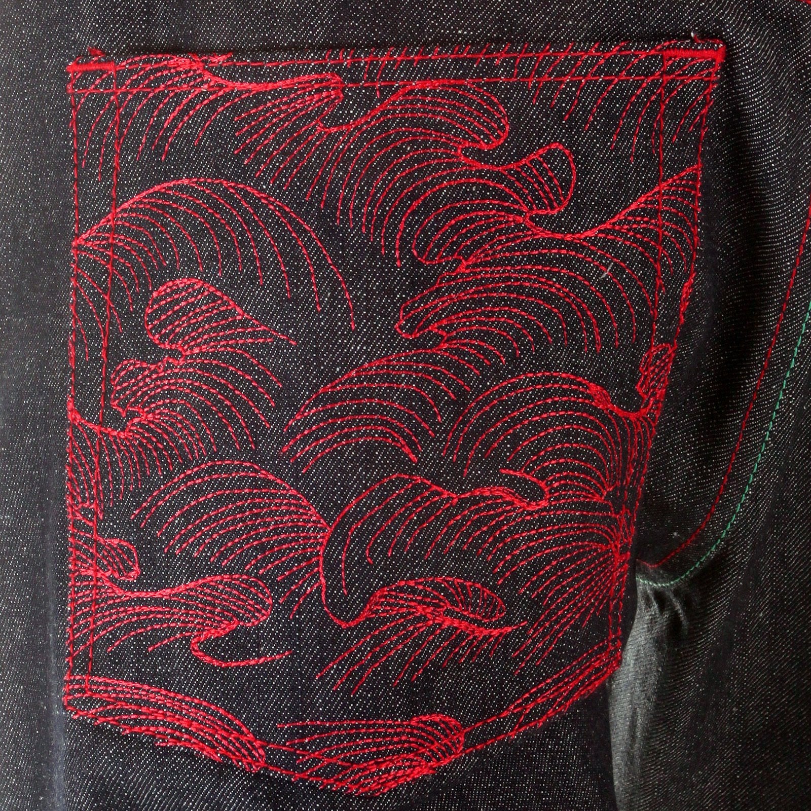 RMC MARTIN KSOHOH MAD PATCH SCARLET AND GREEN EMBROIDERED DARK INDIGO RAW DENIM JEANS WITH VINTAGE CUT REDM3127