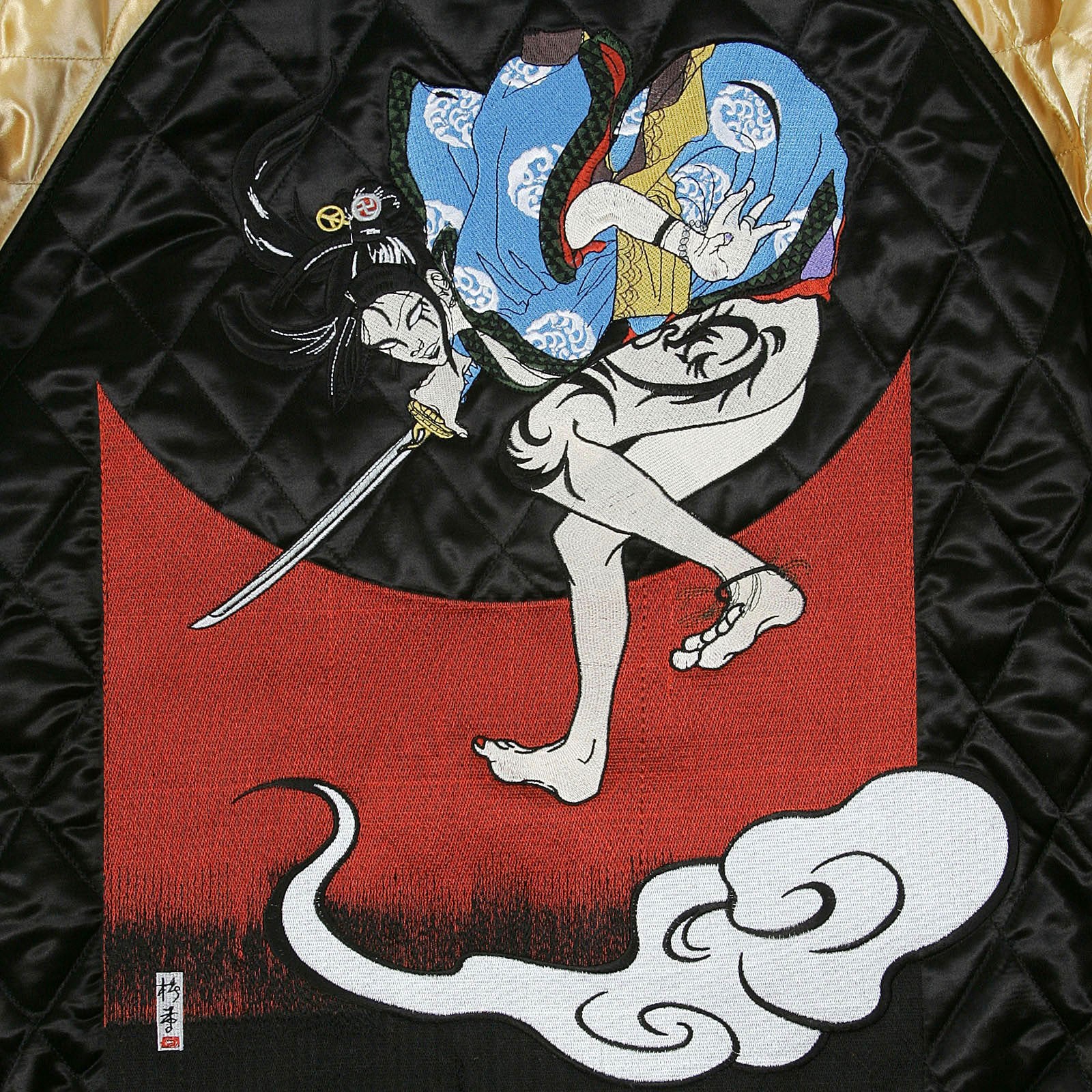 YOROPIKO X RMC JEANS REVERSIBLE EMBROIDERED 4A HERO SOUVENIR JACKET WITH QUILTED BLACK BODY AND GOLD SLEEVES YORO2140A