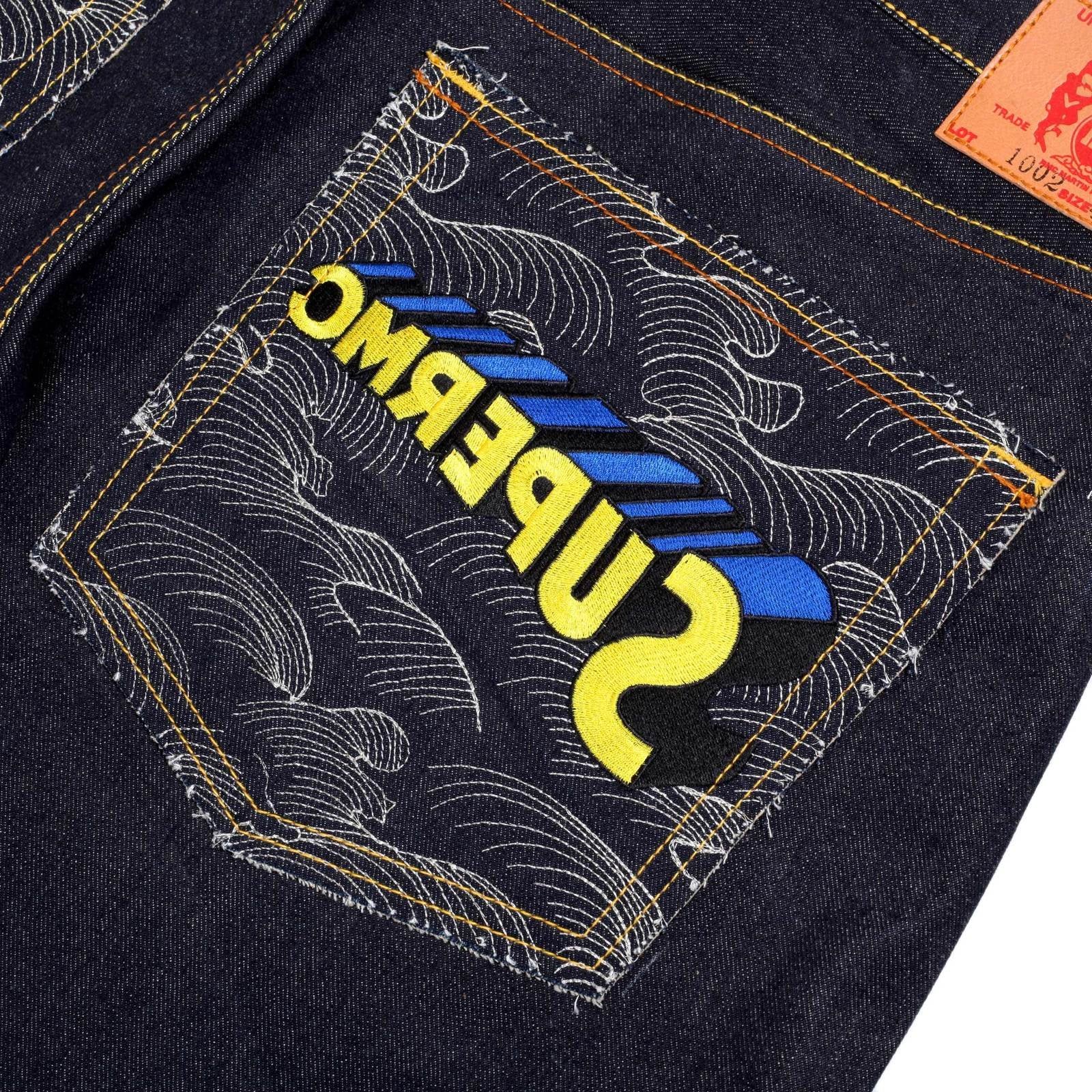 RMC JEANS VINTAGE CUT DARK INDIGO RAW SELVEDGE DENIM JEANS WITH SUPERMAN SUPERMC EMBROIDERY REDM3698